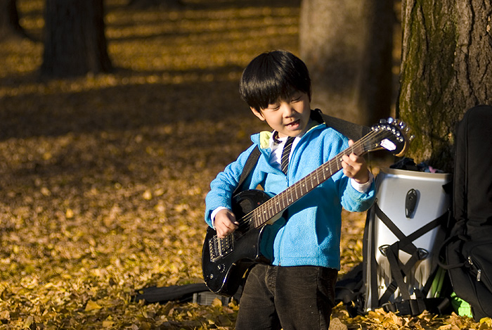 yoyogi park autumn boy guitar